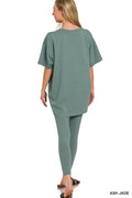 Model in ash jade two-piece loungewear: oversized tunic top and matching leggings.