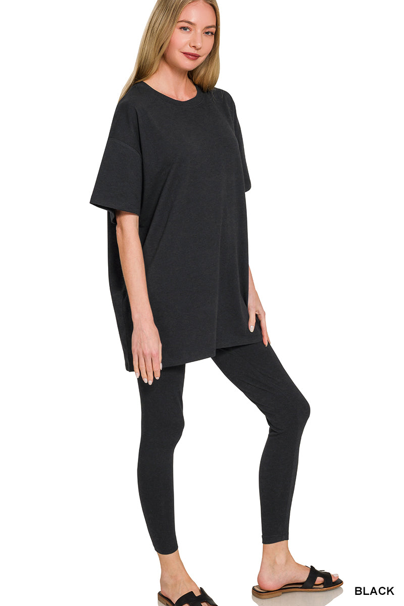 Black two-piece loungewear set with an oversized tee and matching leggings.